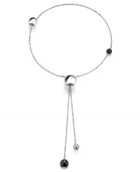 Simple and sophisticated. Add a modern edge to your style with Breil's Chaos lariat necklace. Featuring adjustable spheres, it's made in silver tone stainless steel with natural black stones. Approximate length: 28 inches.