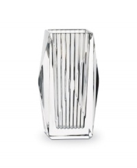 Masculine in its bearing, the Louxor vase by Baccarat creates an impressive statement wherever it is displayed. Designed with cuts specifically to maximize refraction and clarity of the high-quality crystal, its elegance is unparalleled.