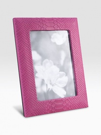 Display your memories in this handmade frame, wrapped in python-embossed leather with sturdy metal easel and convenient rear drop-down door for easy access.LeatherMade in USA DIMENSION INFORMATION 4 X 65 X 7