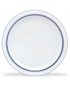 Named for a trendy Copenhagen neighborhood but designed with timeless style, the Christianshavn Blue salad plate features a double band of navy in pristine white porcelain. From Dansk.