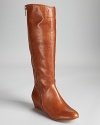 Corso Como's Doyle boots make a statuesque appearance in pebbled leather, equipped with a 2 wedge for a luxe lift.