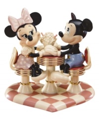 Mickey Mouse and Minnie Mouse savor one sweet treat in this charming Disney ode to the classic soda fountain. Accented with 24-karat gold and measures 7.75.