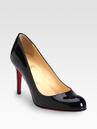 Basic round toe silhouette in lustrous patent leather with intricate stitching and a substantial heel. Self-covered heel, 3½ (85mm)Patent leather upperLeather liningSignature red leather solePadded insoleMade in ItalyOUR FIT MODEL RECOMMENDS ordering one size up as this style runs small. 