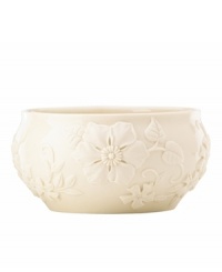 Teeming with fresh blooms in graceful ivory porcelain, the Floral Fields bowl from Lenox has a serene, understated elegance. A simple silhouette balances elaborate sculpted detail.