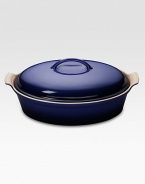 Crafted from heavy stoneware, Le Creuset cookware is the ultimate ingredient for chefs and home cooks worldwide. With its secure lid, this covered casserole is a convenient choice for transporting dishes to parties and picnics. Not only does the lid provide an effective moisture and heat lock for the dish, but it prevents spills and protects its contents.