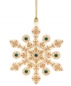 A traditional snowflake gets a makeover in this beautiful ornament from Lenox. Features an ornate gold design with emerald accents for a touch of glimmer. With gold hanging thread.