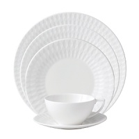 Embossed with clean, geometric patterns comprised of subtle diamond shapes, this attractive set of dinnerware is crafted in pure white bone china for a mannered elegance that complements your finest table setting.