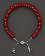 Varnished red wooden beads on a sterling silver bracelet from Gucci.