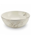 Sweet yet sophisticated, a loopy ribbon design sweeps across this porcelain vegetable bowl from Mikasa. Complete with a sparkling platinum rim, this flirty pattern captivates everyone at your dinner table.