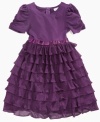 Ruffles fall down the skirt of this tiered dress from Sweet Heart Rose, giving her a flowing style she'll love to show off. (Clearance)