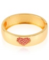 Show your heart's in the right place with this bangle from Betsey Johnson. Crafted from antique gold-tone mixed metal, the bracelet features pink accents in a pattern you're sure to love. Item comes packaged in a signature Betsey Johnson Gift Box. Approximate diameter: 2-3/8 inches.