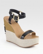 Grounded by a two-tone linen covered wedge, this classic design has adjustable leather straps and a rubber sole for traction. Linen-covered wedge, 5 (125mm)Linen-covered platform, 2 (50mm)Compares to a 3 heel (75mm)Leather and linen upperLeather liningRubber soleImported