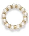 The classic appeal of pearls gets an elegant upgrade on this Charter Club bracelet. The acrylic pearls are paired with gold tone spacers embellished with glass accents. Stretches to fit wrist. Crafted in gold tone mixed metal. Approximate width: 2-3/4 inches.