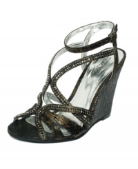 Turn heads with the edgy elegance of the Dove In sandals by Kenneth Cole Reaction. Sexy snake print and a wedge heel are guaranteed to catch eyes.