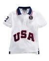 A breathable cotton mesh polo is accented with bold country embroidery, celebrating Team USA's participation in the 2012 Olympics.