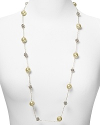 Embellished with delicate pearl and crystal stations, Carolee's illusion necklace sparkles with versatility -- elegant whether worn to dress up denim or enliven a classic white blouse.