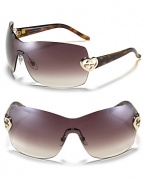 Fall in love with these shield sunglasses featuring a metal heart logo embellishment at temples.