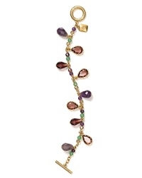 A distinctive dangle of precious stone beads, glass, and resin stoned dresses up this Lauren Ralph Lauren charm bracelet, finished with a simple toggle closure.