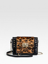 This miniature design combines smooth leather with leopard-print calf hair and gleaming hardware for a luxurious effect. Detachable chain and leather shoulder strap, 22½ dropFlap closure with turn-lockOne inside zip pocketOne inside open pocketEight credit card slotsCotton lining7¾W X 5H X 1DImported