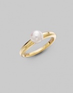 From the Classic Elegance Collection. A design that could hardly be simple, with one lustrous white Akoya pearl perched atop a sleek gold band. 6.5mm white, round cultured pearl Quality: A+ 18k yellow gold Imported