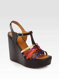 Flirty leather t-strap with a chunky wedge and adjustable multicolored straps. Self-covered wedge, 5 (125mm)Island platform, 1½ (40mm)Compares to a 3½ heel (90mm)Leather upperLeather liningRubber solePadded insoleMade in SpainOUR FIT MODEL RECOMMENDS ordering one half size up as this style runs small. 