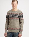 A soft, sumptuous wool blend is knitted in a playful and colorful Fair Isle pattern for traditional seasonal style.CrewneckRibbed knit collar, cuffs and hem80% wool/20% nylonDry cleanImported