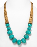 Tribal-inspired chic from RJ Graziano. This bold necklace marries graduated wooden discs with multifaceted turquoise beads for a versatile piece that works with a black dress or dark jeans.