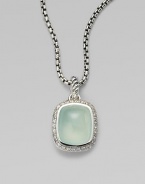 From the Noblesse Collection. A beautiful center stone of aqua chalcedony surrounded by a row of brilliant diamonds on a sterling silver box link chain. Aqua chalcedonyDiamonds, .3 tcwSterling silverLength, about 17Pendant size, about ½Lobster clasp closureImported 