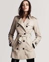 Burberry London's timeless trench evokes endless wear with a versatile short length and slimming, belted silhouette.