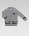 Classic cardigan with shawl collar, rendered in extra-fine merino wool with contrasting stripes and Gucci crest patch.Shawl collarLong sleevesButton-frontFront patch pocketsRibbed cuffs and hemMerino woolDry cleanMade in Italy Please note: Number of buttons may vary depending on size ordered. 