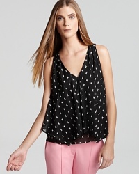 A breezy Theory top showered with an allover abstract star print and defined by a chic front slit in pure silk.