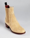 MARC BY MARC JACOBS take the must-have chelsea boot into modern territory with this streamlined version in soft suede. Ribbed and grooved details lend a unique, utilitarian touch.