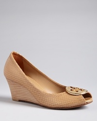 Tory Burch's Sally style is popular for good reason, with great looks and iconic logo hardware on wearable wedge heels.