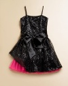 Full of frill, this notice-me frock shines like a disco ball covered in sequins and then finished off with a full, peekaboo hem.Straight necklineSleeveless with spaghetti strapsBack zipperWaistband with sash tieFull skirt with peekaboo hemPolyesterDry cleanMade in the USA of imported fabric