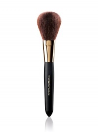 EXCLUSIVELY AT SAKS. An all purpose brush that glides soft and sensual against the skin for meticulous coverage. It provides a smooth even finish with a full dome shape assembled of sumptuous natural bristles, designed for applying pressed powder, loose powder and bronzing powder 