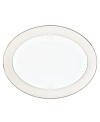 Refine your formal table with classic cream and white Lenox dinnerware. Dishes, including this Opal Innocence Scroll bone china oval platter, are trimmed in platinum and accented with a raised dot and scroll pattern, bringing contemporary grace to special occasions. A pearlized finish adds subtle shimmer.