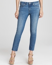 Roughened up and slightly faded, these Juicy Couture skinny jeans set the stage for this season's statement wedges and strappy heels with a chic, cropped silhouette.