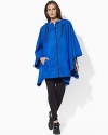 A weather-resistant windbreaker in a chic poncho silhouette is constructed from microfiber for maximum comfort and an easy swing.