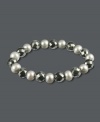 Add sophistication to your style. This chic beaded bracelet features faceted hematite (127-3/4 ct. t.w.) and grey cultured freshwater pearls (7-5/8 mm). Bracelet stretches to fit wrist. Approximate length:7-1/2 inches.