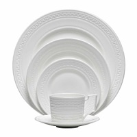 Urban chic and elegance are the hallmarks of the new Intaglio collection from Wedgwood, yet drawing its design inspiration from the delicate embossing of the Georgian era, the fresh white color way is crisp, clean and contemporary. Intaglio highlights the traditional skills of knurling and engine turning, the arts of indenting designs in wet clay to give a distinctive tactile finish. The designs are unique across all the pieces and bring an intricate web of fresh but understated silhouette to the table.