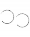 Classic cool. Nine West's J-shaped hoop earrings, crafted from silver-tone mixed metal, sparkle with glass crystal accents for a dash of elegance. Approximate diameter: 1-6/10 inches.