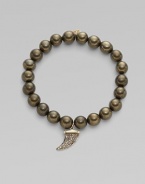 This pyrite beaded, stretch design is accented with a diamond embellished 14k gold and rhodium horn charm for a modern look. Pyrite beads14K goldDiamonds, .22 tcwLength, about 6¾Elastic slip-on styleMade in USA of imported materials