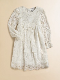 Nothing's lovelier for your young lady than the airy swirls of this lavish lace frock with a flowing skirt and a scalloped hem.Round necklineLong sleeves with ruffled cuffsEmpire waist with bowBack button closeSilk/cotton liningRayon/cotton/nylon/silkDry cleanImported Please note: Number of buttons may vary depending on size ordered. 