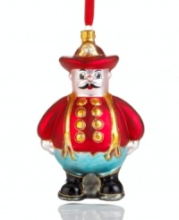 First reporting for duty in 1948, Harold the fireman is now an official balloon for Macy's Thanksgiving Day Parade. In glass with glitter detail, his collectible Christmas ornament is a salute to New York City's bravest.