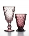 Made of amethyst-colored glass, this set of 6 purple footed wine glasses (shown left) from French Home drinkware is the ultimate in chic barware. Textured with classic Lyonnais pattern, they will bring European sophistication right to your table.