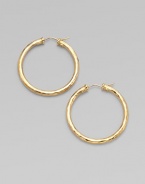 From the Martellato Collection. Graceful hoops with a rich hammered texture in gleaming 18k gold.18k yellow goldDiameter, about 1¾PiercedMade in Italy