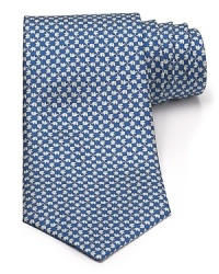 A silk tie adds distinction and flair to your formal presentation. With a repeating pattern of elephants, you'll also punch up your attire with a bit of wit.