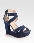 Supported by an artful cutout wedge and platform, this velvety suede silhouette has intertwining criss-cross straps and an adjustable ankle strap. Self-covered wedge, 4 (100mm)Covered platform, 1 (25mm)Compares to a 3 heel (75mm)Suede upperLeather lining and solePadded insoleImported