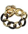 A versatile choice for mixing and matching. Jet black links combine with gold tone mixed metal details on this Anne Klein flex bracelet. Approximate length: 7-1/2 inches.