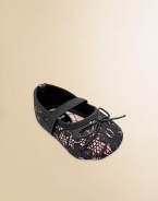 A pretty lace overlay with tiny bows and elastic straps across the instep.Polyurethane shoeRound toeElastic instep strapMicrofiber liningSoft polyurethane soleImportedAdditional InformationKid's Shoe Size Guide (European Equivalent) 